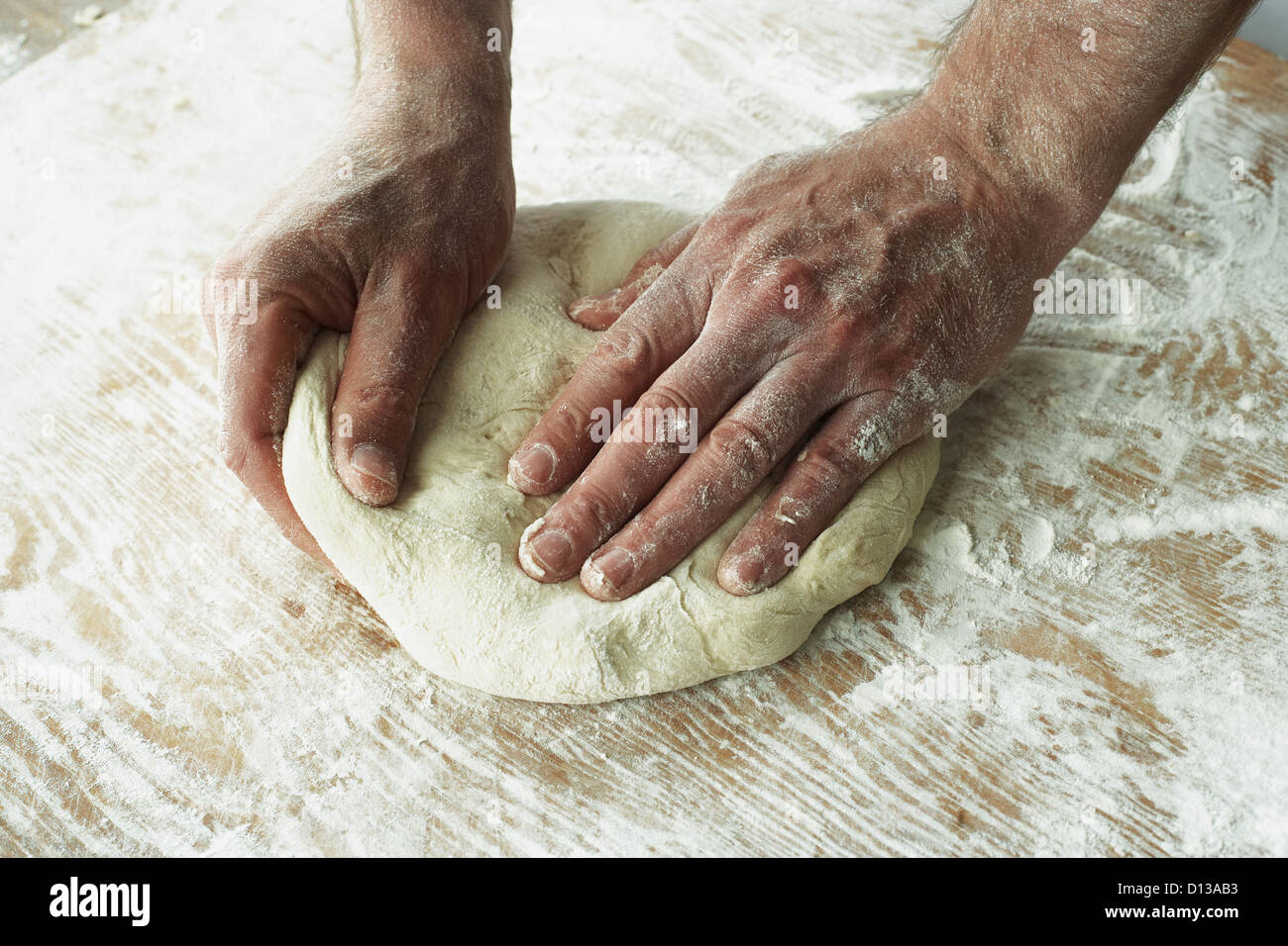 Close-Up Of Hands Kneading Dough Stock Photo - Alamy