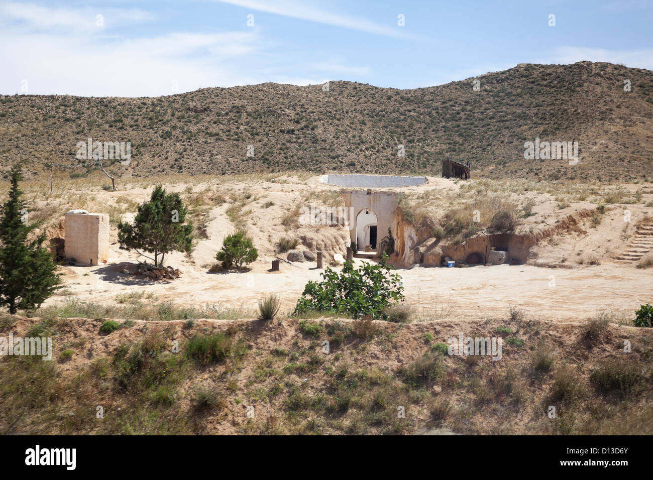 Courtyard in rock. An underground house of troglodytes in Tunisian ...