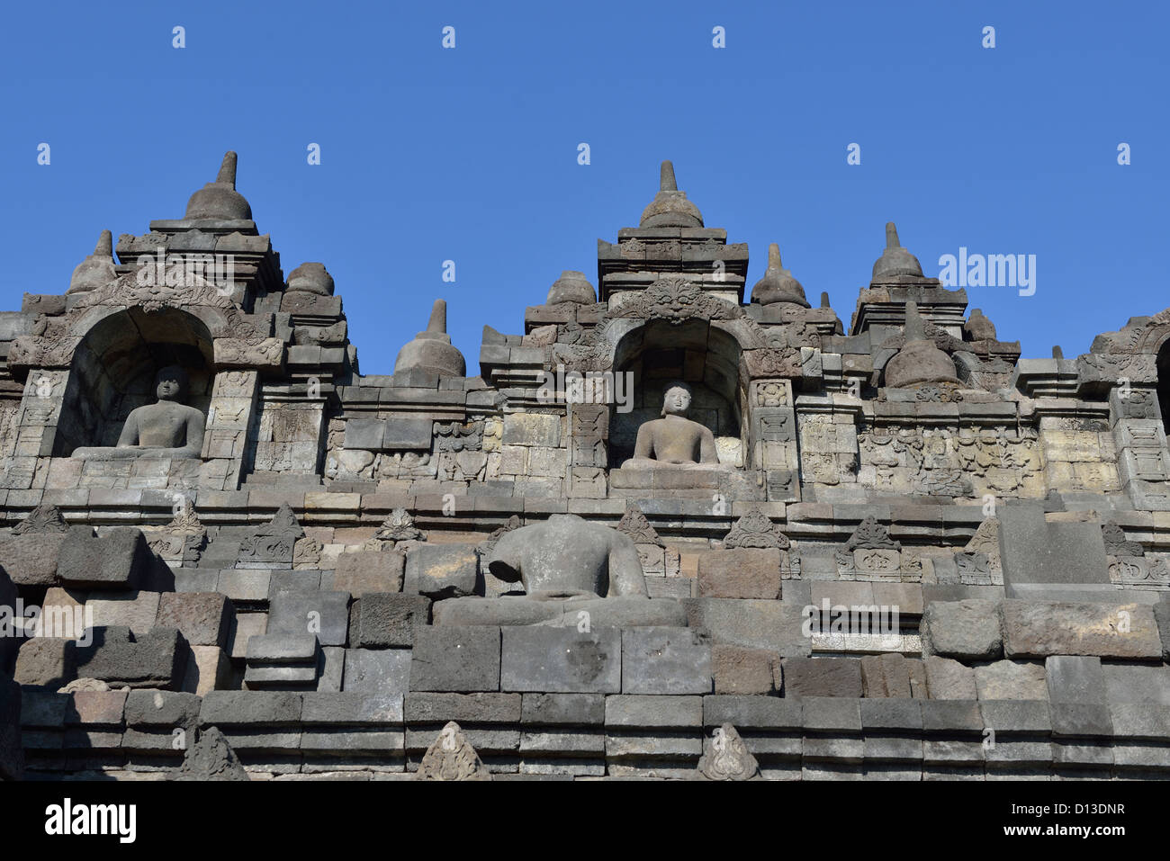 Buddha' statues and stoupas in the more than 1000 year-old Borobudur; Central Java, Indonesia. Stock Photo