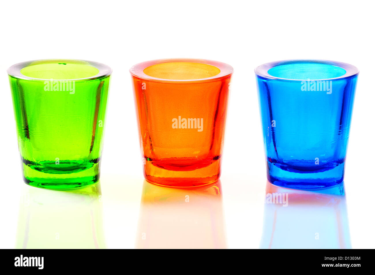three color blue, red and green glass candlestick Stock Photo Alamy