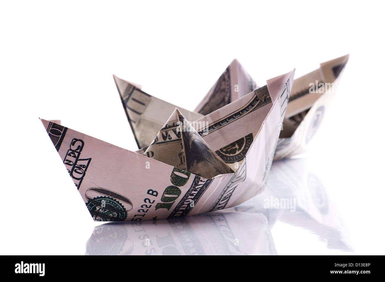 paper boats from dollars banknote on white Stock Photo - Alamy
