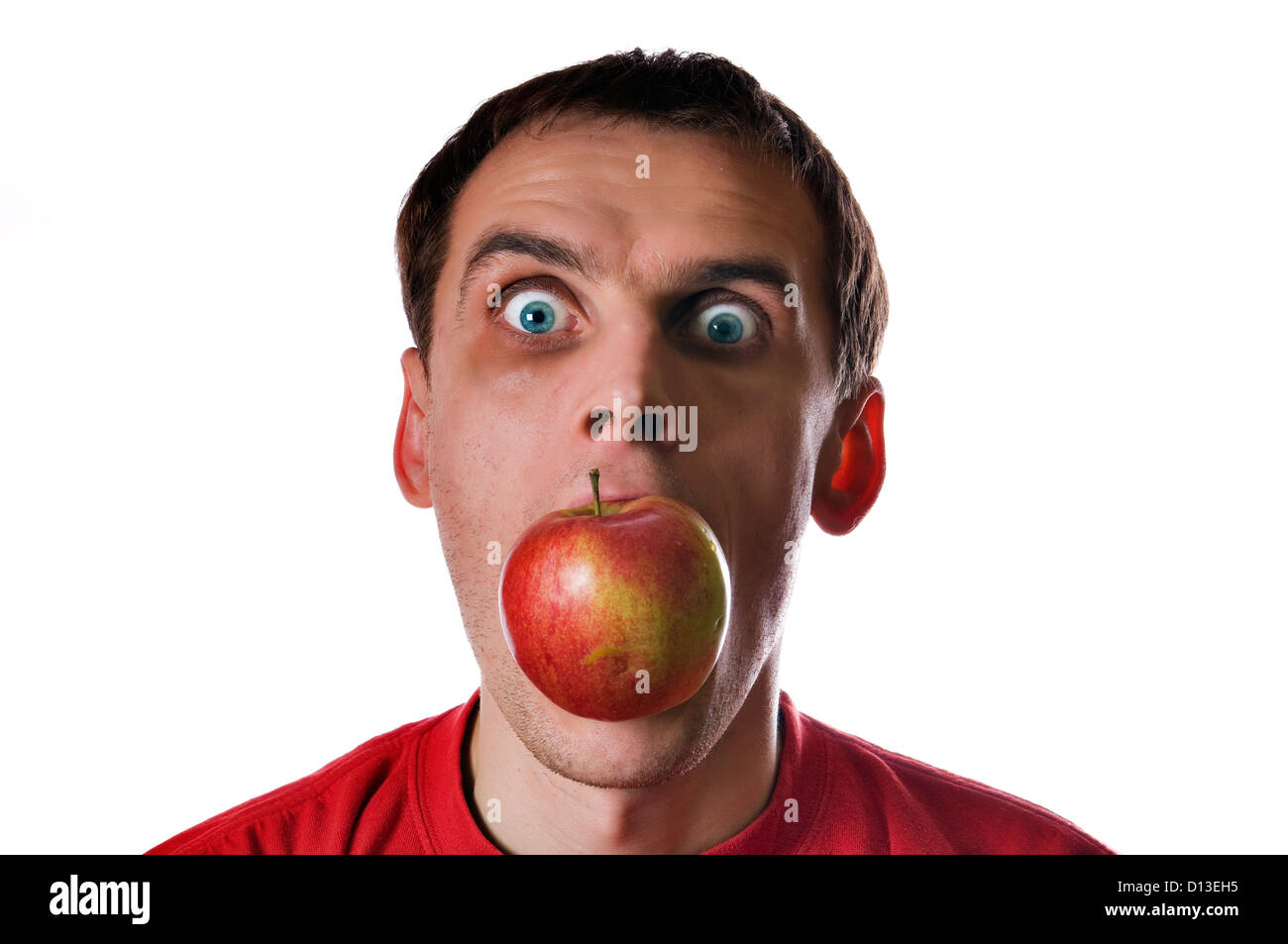 Apple in mouth hi-res stock photography and images - Alamy