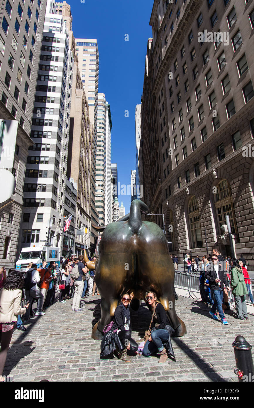 Tourists at The bull of Wall Street, Financial district, New York City, USA Stock Photo