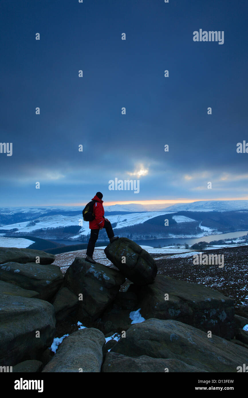 Adult male walker overlooking Ladybower reservoir, Wintertime, Upper Derwent Valley, Peak District National Park, Derbyshire Stock Photo