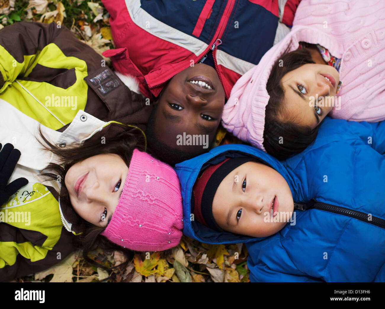 Children lying down in circle hi-res stock photography and images - Alamy