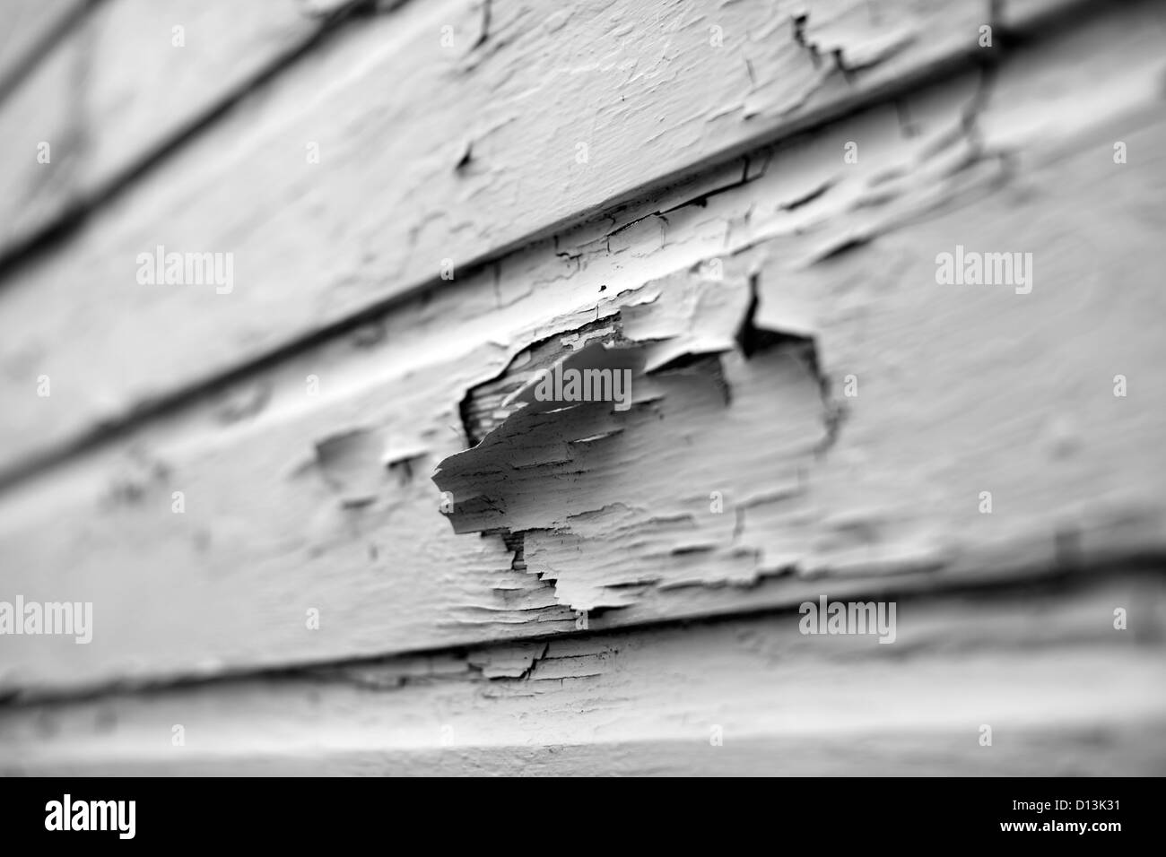 Old wood siding with peeling paint Black and White Stock Photos