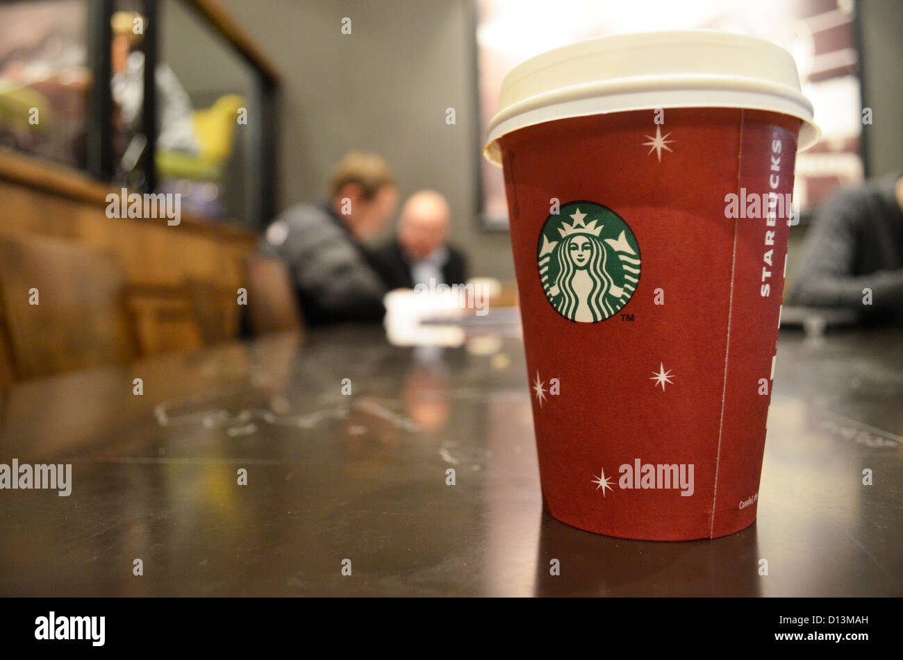 A Starbucks latte in a Christmas cup Stock Photo