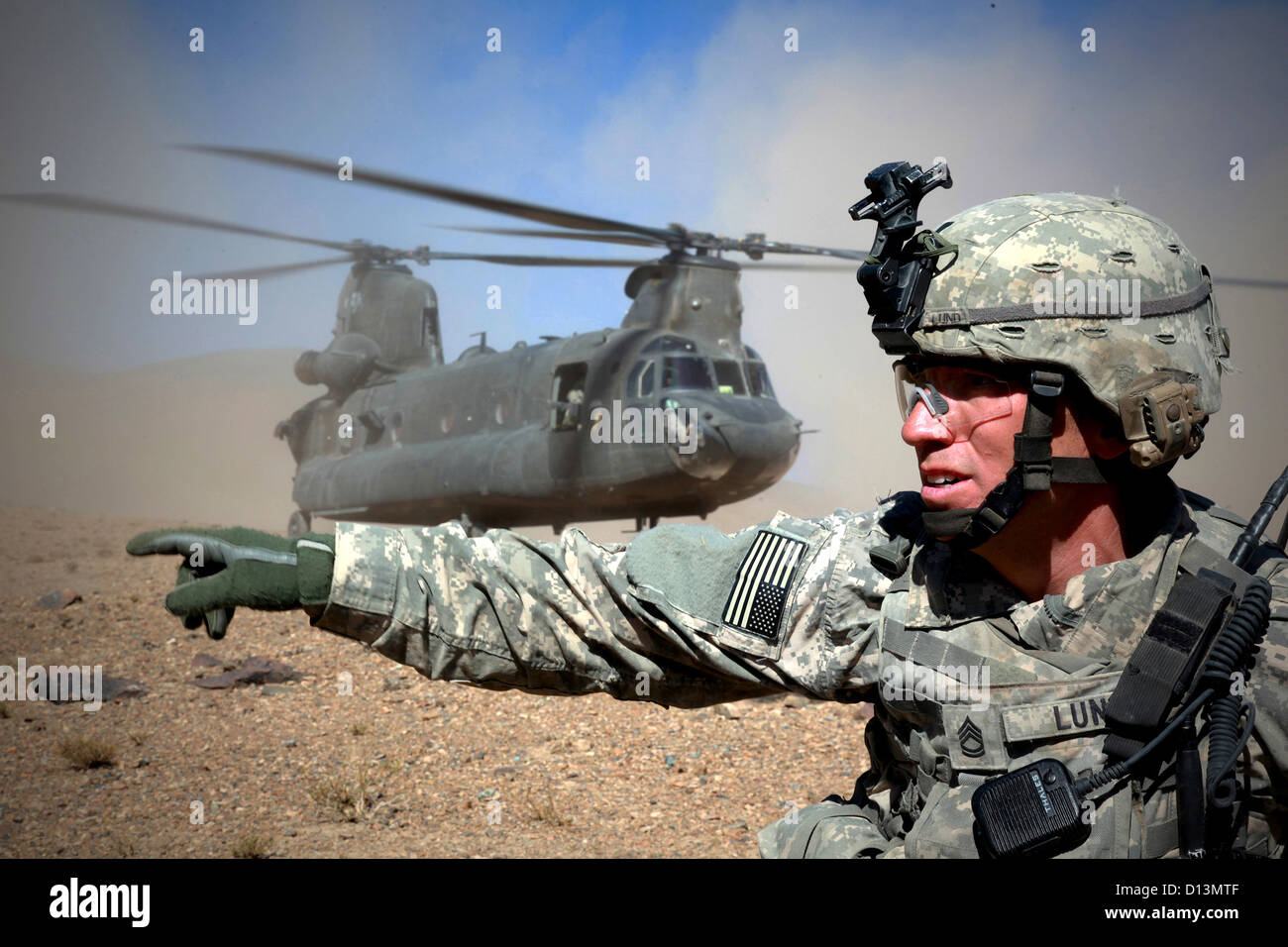 US Army soldier conducts check his fellow soldiers before boarding a CH47 Chinook October 12