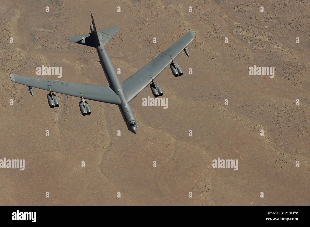 Aerial view down at a B-52 Stratofortress fling over the desert March 26, 2012 in Utah. Stock Photo