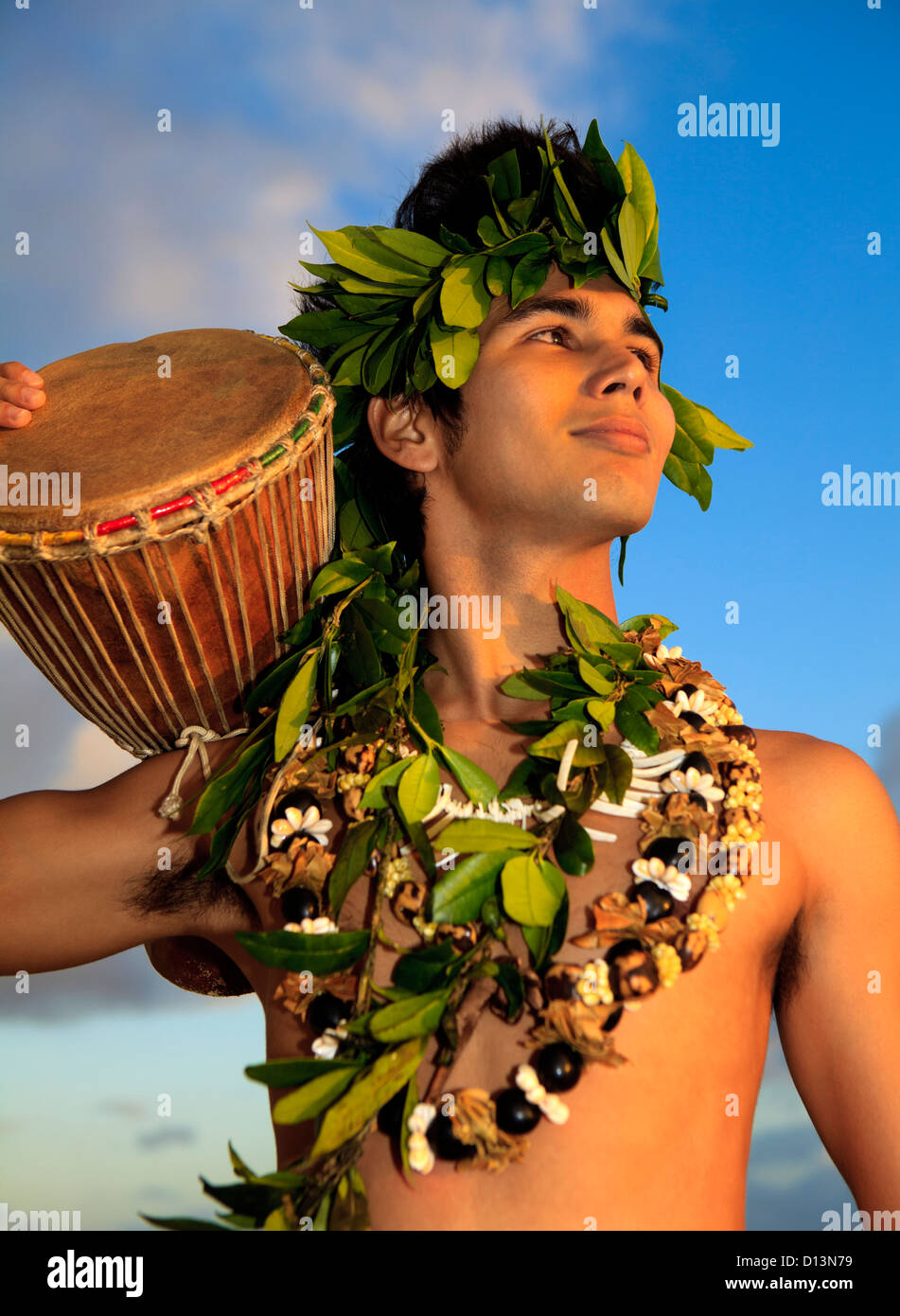 Hawaii, Oahu, Polynesian Man With Drum Along Coast, Sunrise Light Stock