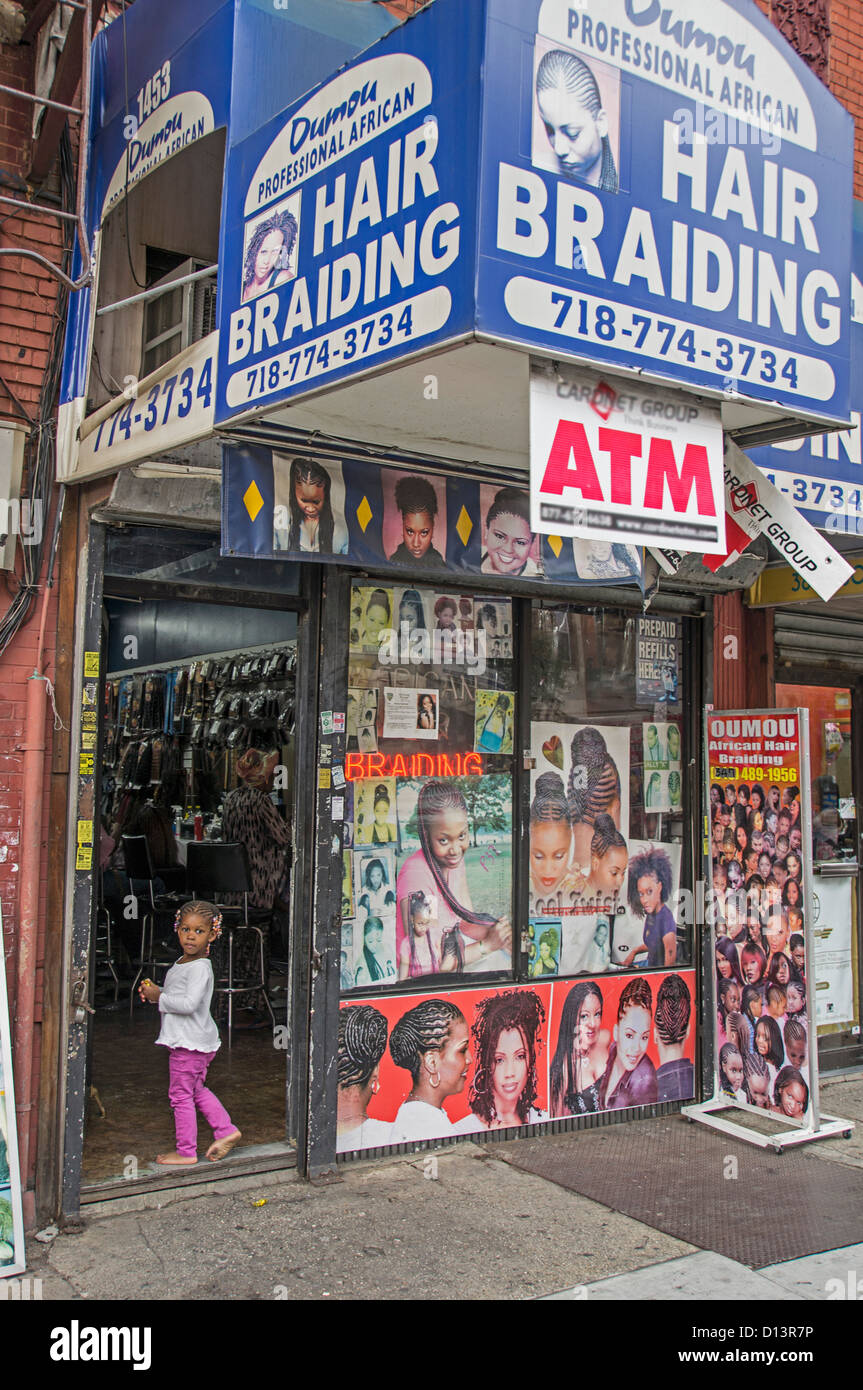 Little girl with Rasta hairs in front of Braiding Shop, Crown Heights