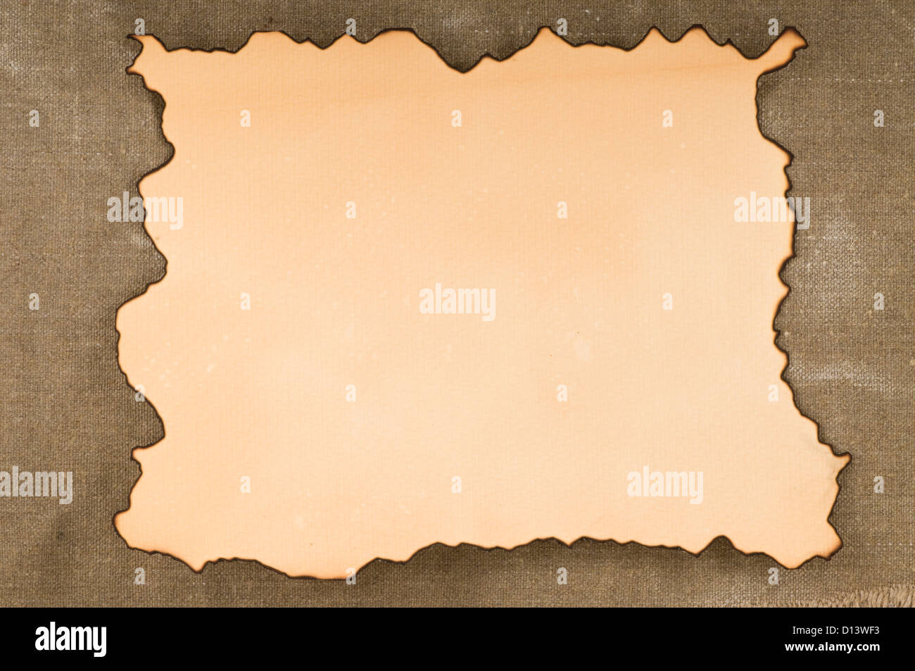 old paper with burn edges on canvas background Stock Photo Alamy