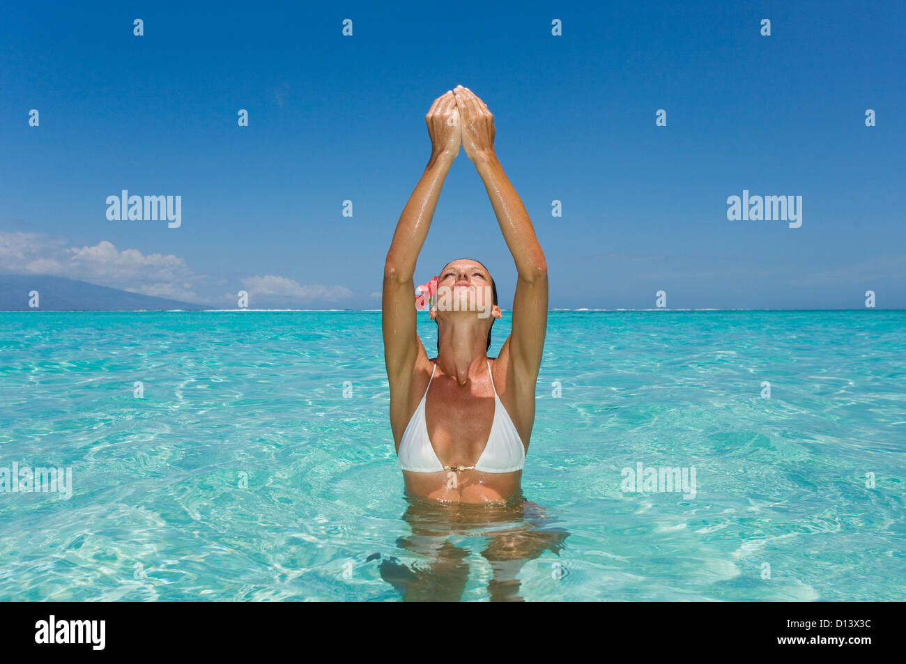 Woman Standing In Tropical Ocean Water. Stock Photo