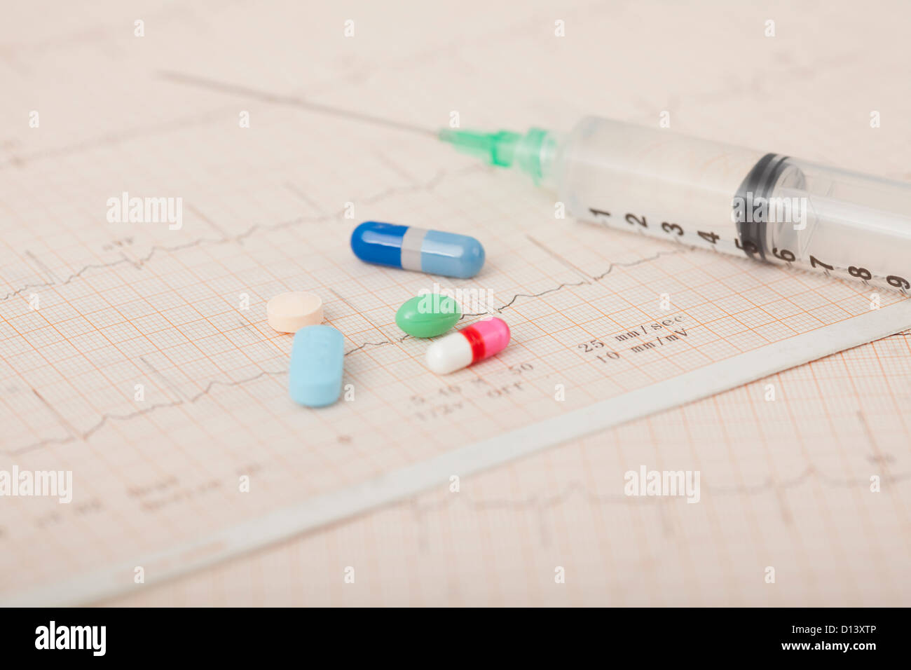 USA, Illinois, Metamora, Close up of medicines and syringe on medical record Stock Photo