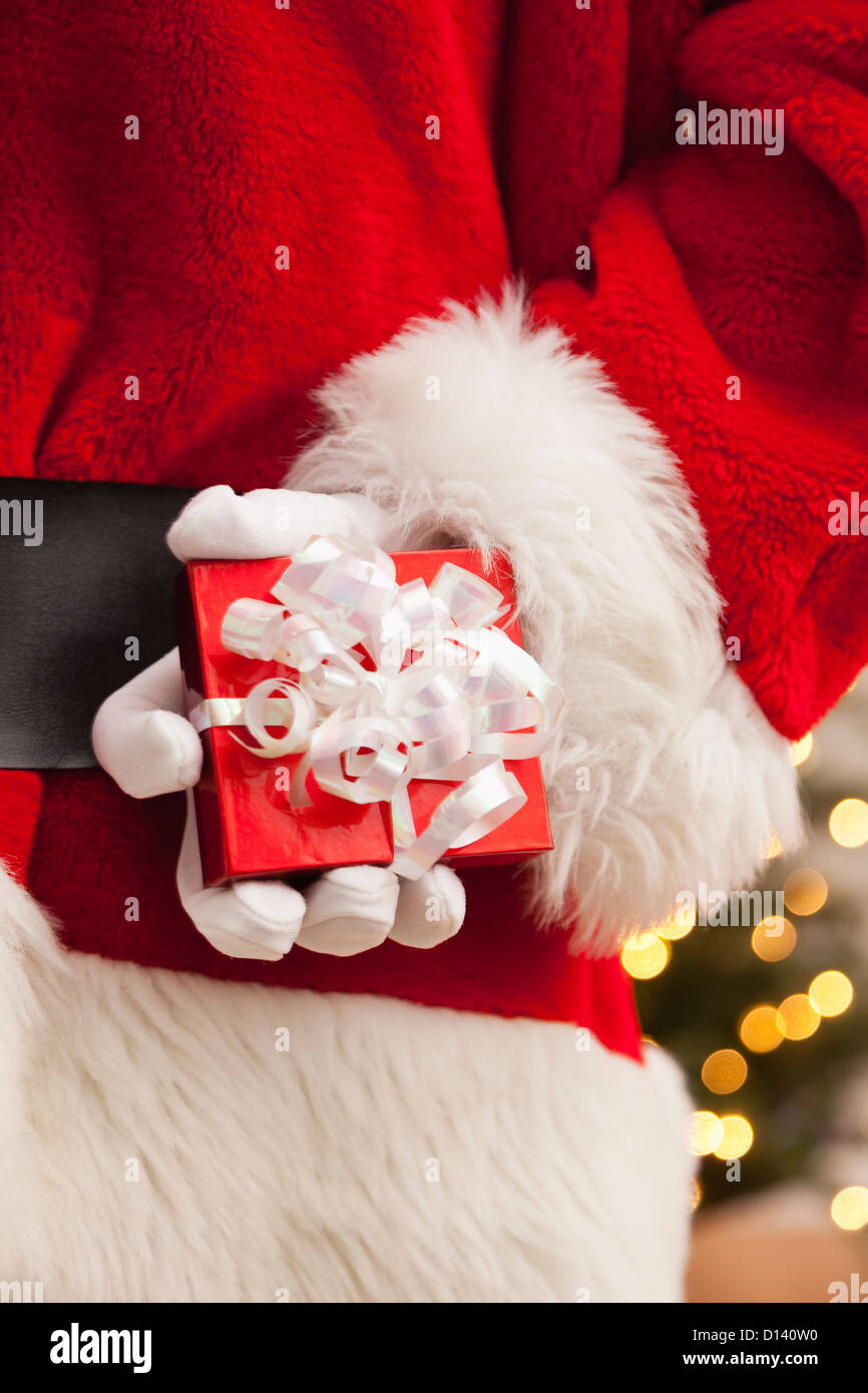 USA, Illinois, Metamora, Santa claus holding small gift Stock Photo