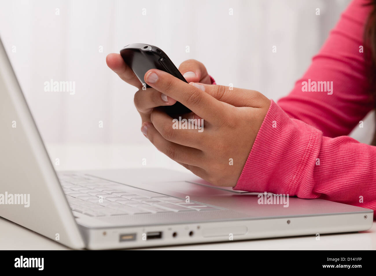 USA, Illinois, Metamora, Woman texting on his mobile in office Stock Photo