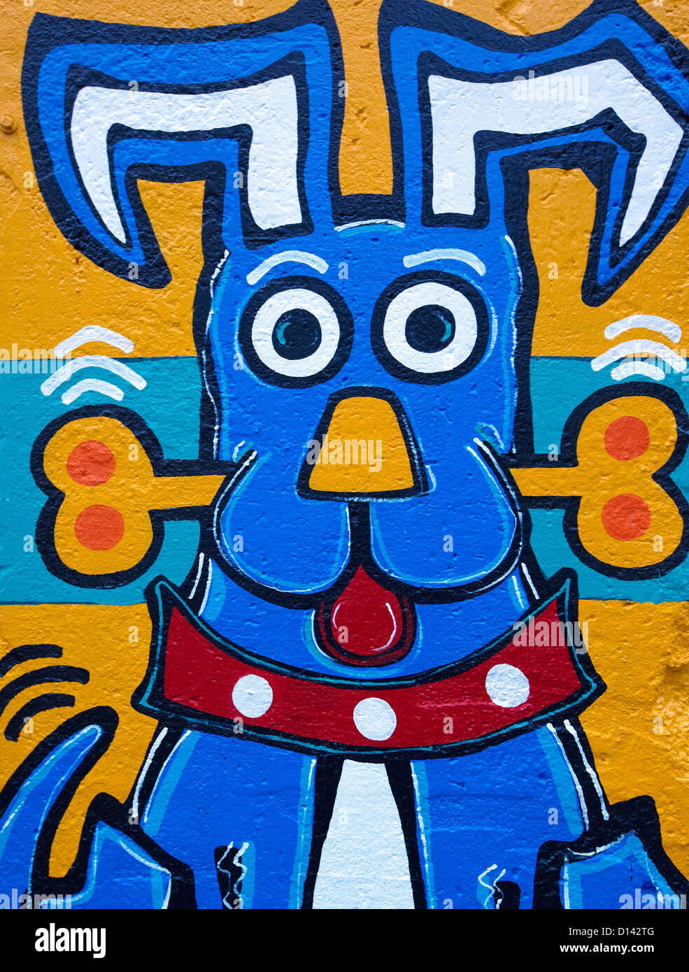 Dog With Bone Graffiti On the Berlin Wall Berlin Germany Stock Photo