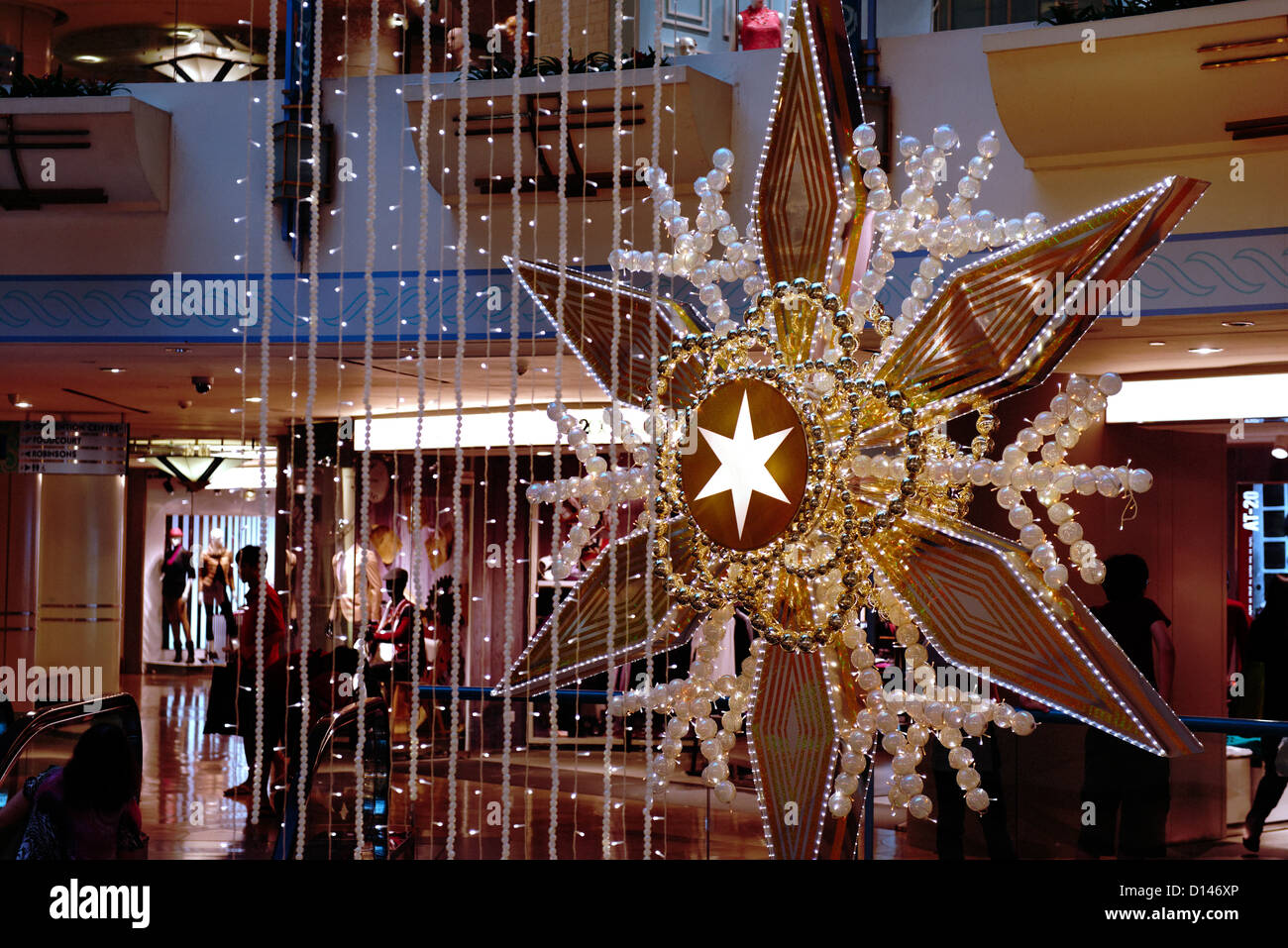 Christmas decorations in star shapes, Raffles city mall, Singapore. Stock Photo