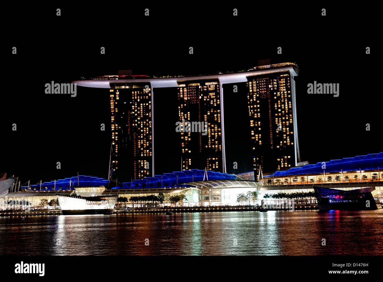 Marina Bay Sands hotel casino and shopping complex with Skypark on the roof, Marina Bay, Singapore at night. Stock Photo