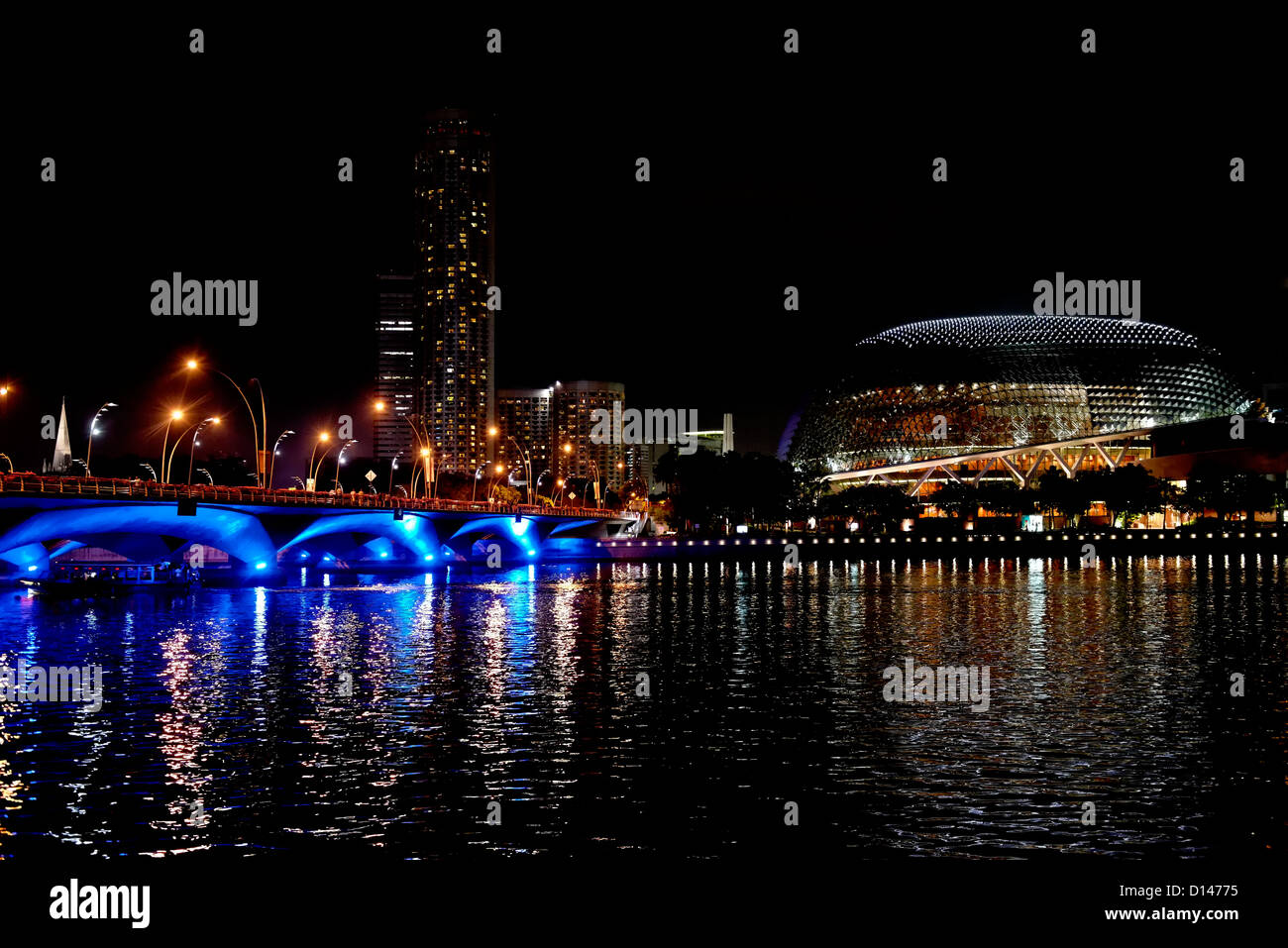 Singapore at night with the Esplanade Opera House, illuminated Esplanade Bridge and swissotel Stamford in the background. Stock Photo