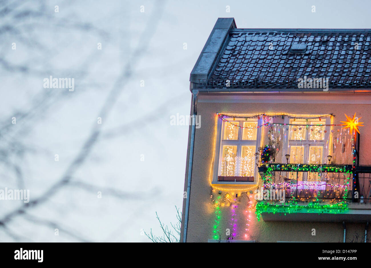 The window and balcony of an apartment are covered with Christmas decorations in Berlin, Germany, 05 December 2012. Photo: Florian Schuh Stock Photo