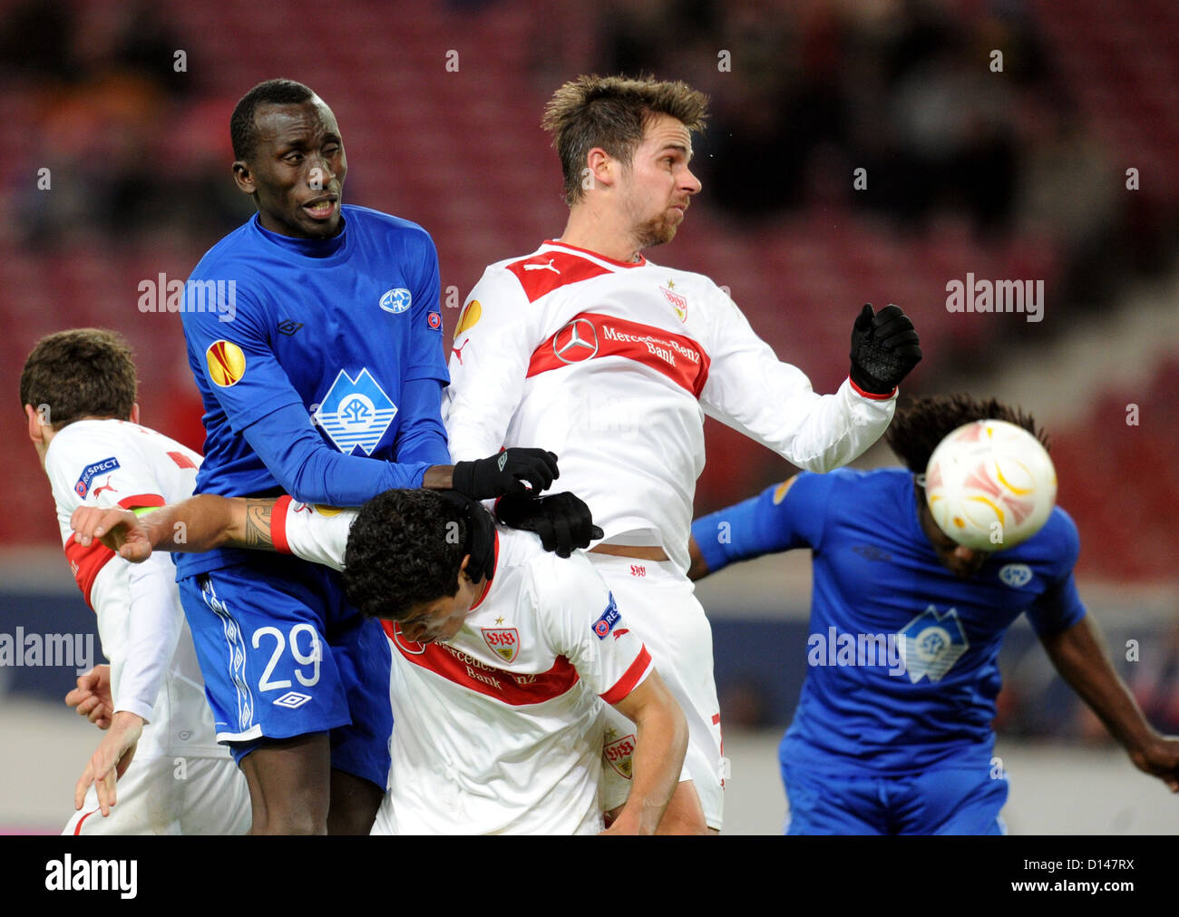 Stuttgarts Martin Harnik (C) vies with Daniel Chima (R) and Pape Pate Diouf (L) of Molde FK during the Europa League group E soccer match VfB Stuttgart vs. Molde FK at VfB Arena stadium in Stuttgart, Germany, 06 December 2012. Photo: Bernd Weißbrod / dpa Stock Photo