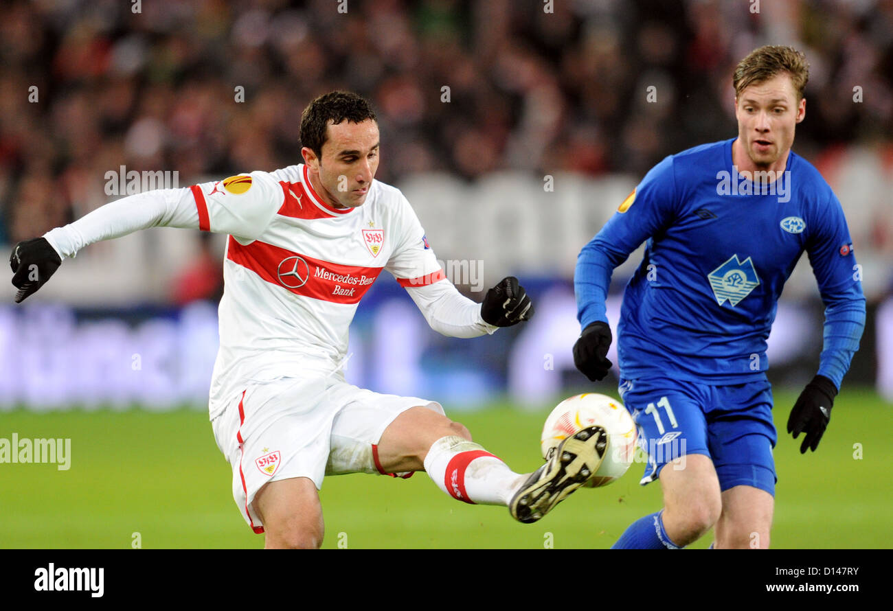 Stuttgarts Cristian Molinaro (L) and Jo Inge Berget (R) of Molde FK vie for the ball during the Europa League group E soccer match VfB Stuttgart vs. Molde FK at VfB Arena stadium in Stuttgart, Germany, 06 December 2012. Photo: Bernd Weißbrod/dpa +++(c) dpa - Bildfunk+++ Stock Photo