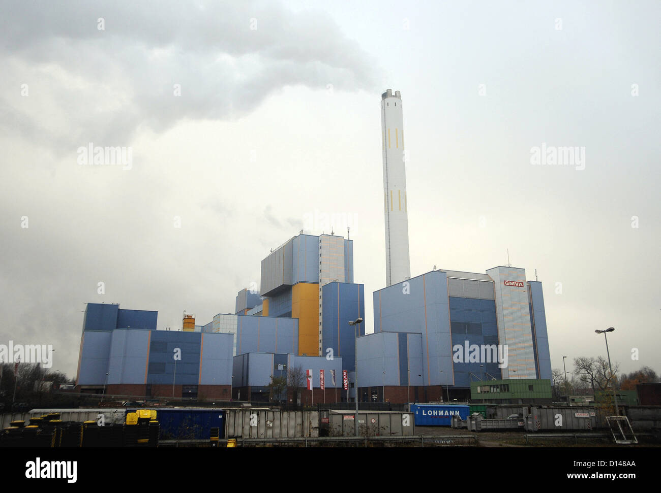A smoking chimney stands tall above the waste incineration plant in Oberhausen, Germany, 28 November 2012. Photo: Henning Kaiser Stock Photo