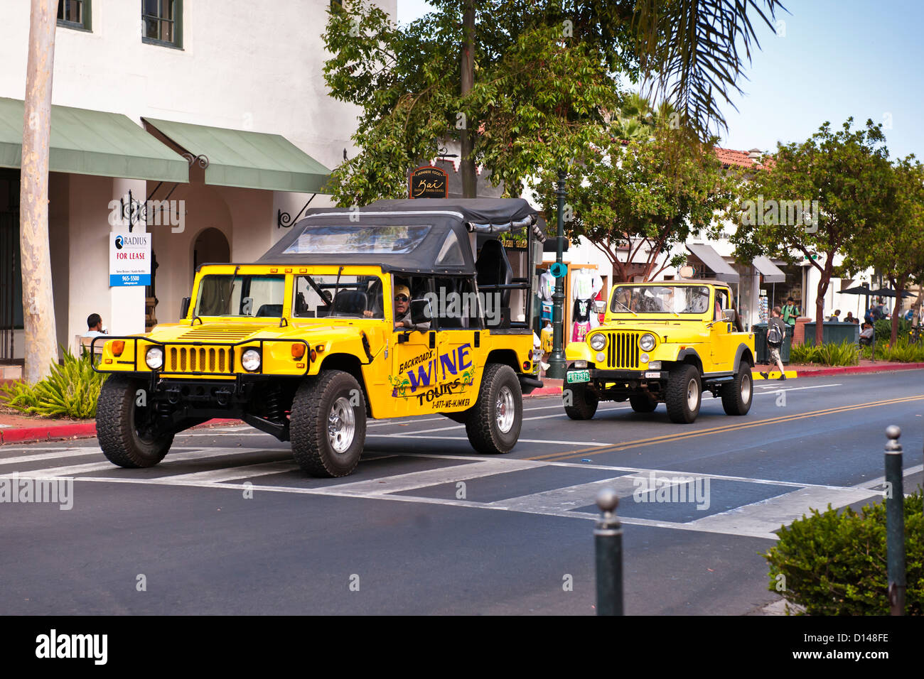Yellow Hummer and yellow Jeep, Santa Barbara Stock Photo