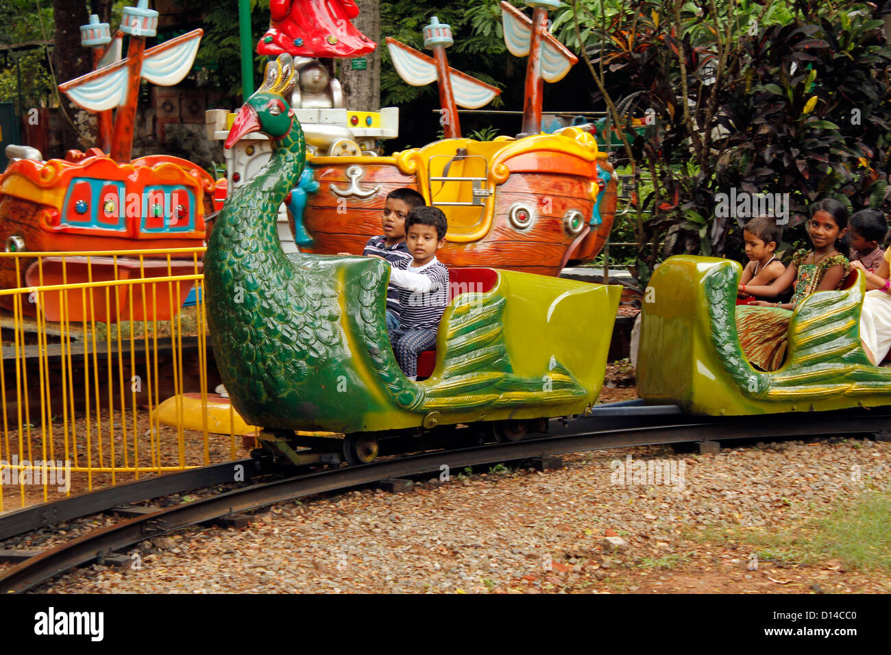children in a train in a park, india Stock Photo