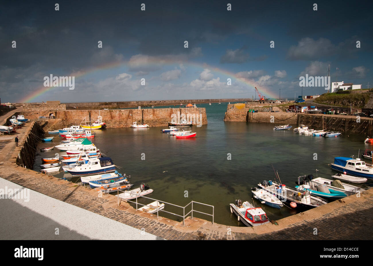 A rainbow over Braye Harbour on Alderney, Channel Islands Stock Photo