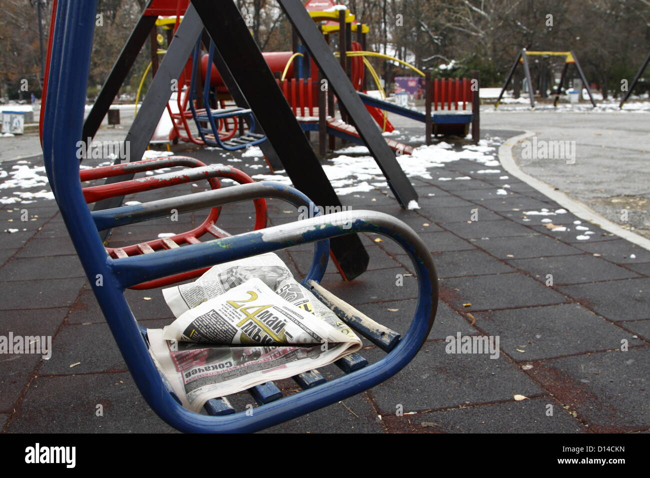 Sofia, Bulgaria. 6th December 2012. Children's swings on a playground in Sofia's Borisova park. Like many other recreational facilities in the Bulgarian capital, the playground suffer from poor maintenance and general neglect. Credit:  Johann Brandstatter / Alamy Live News Stock Photo