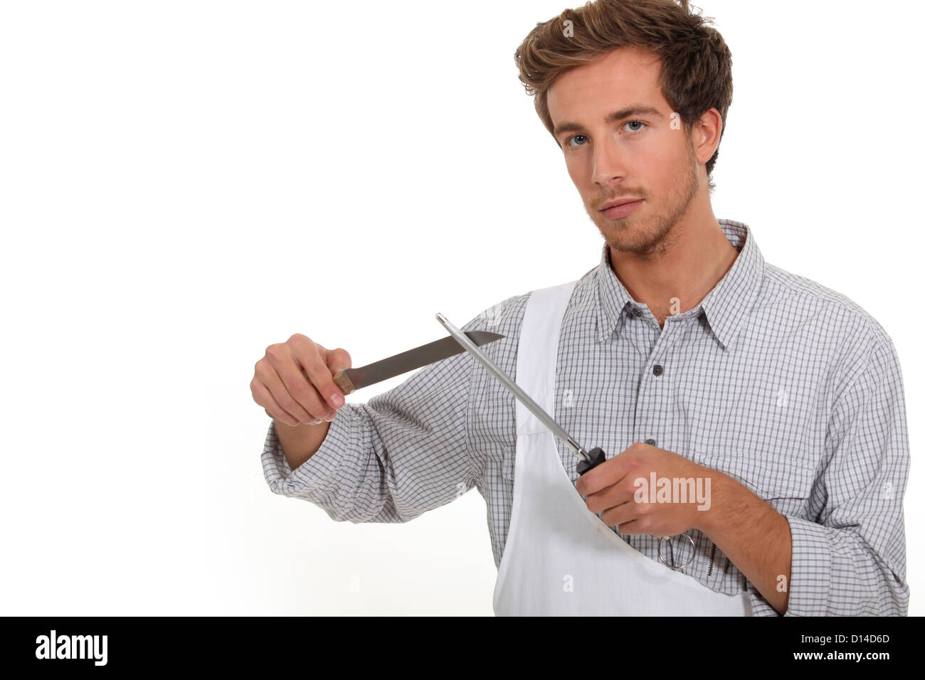 Butcher sharpening a knife Stock Photo Alamy