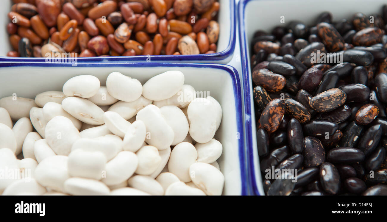 Different types of beans in containers, close up Stock Photo Alamy