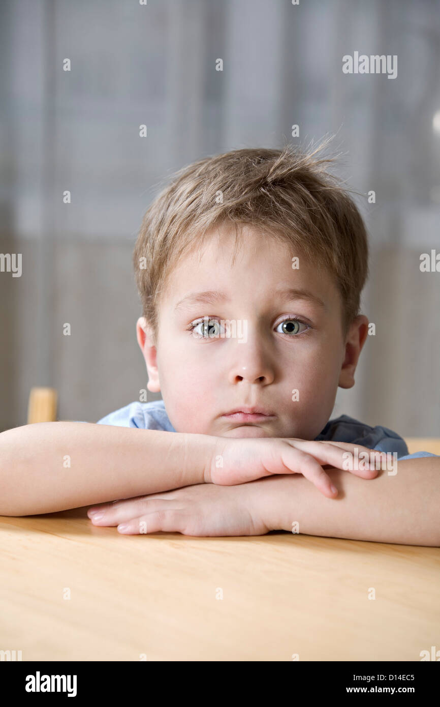 portrait of boy looking bored Stock Photo - Alamy