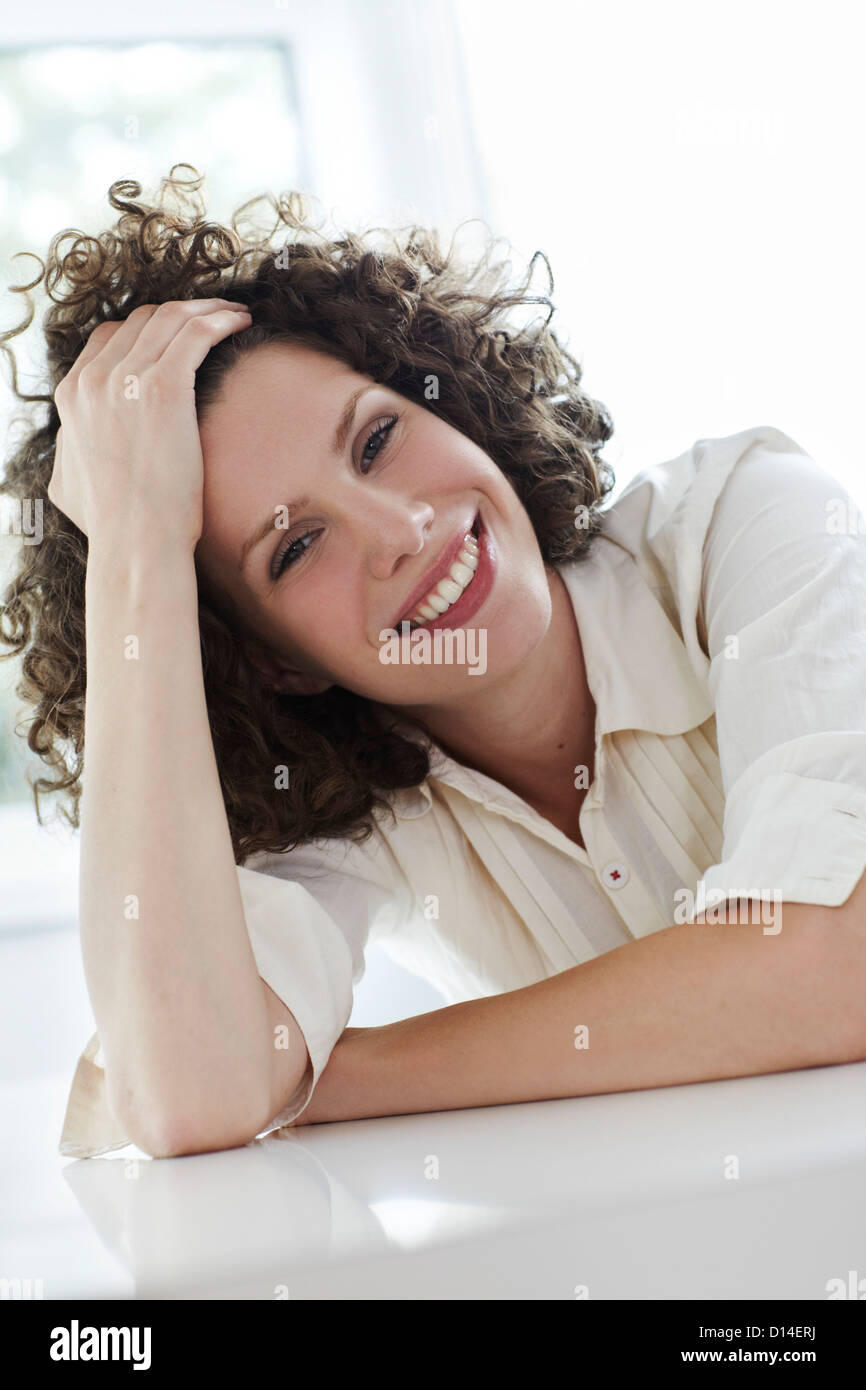 portrait of young woman with curly hair Stock Photo