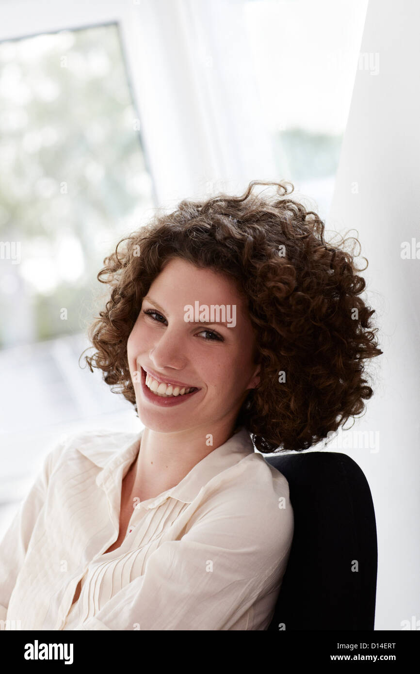 portrait of young woman wirh curly hair Stock Photo