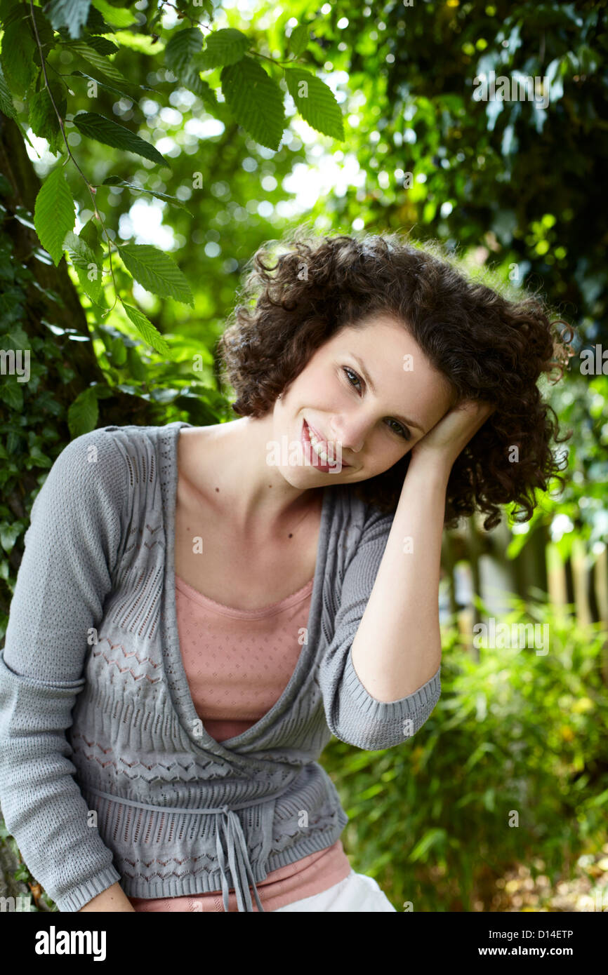 portrait of young woman in garden Stock Photo
