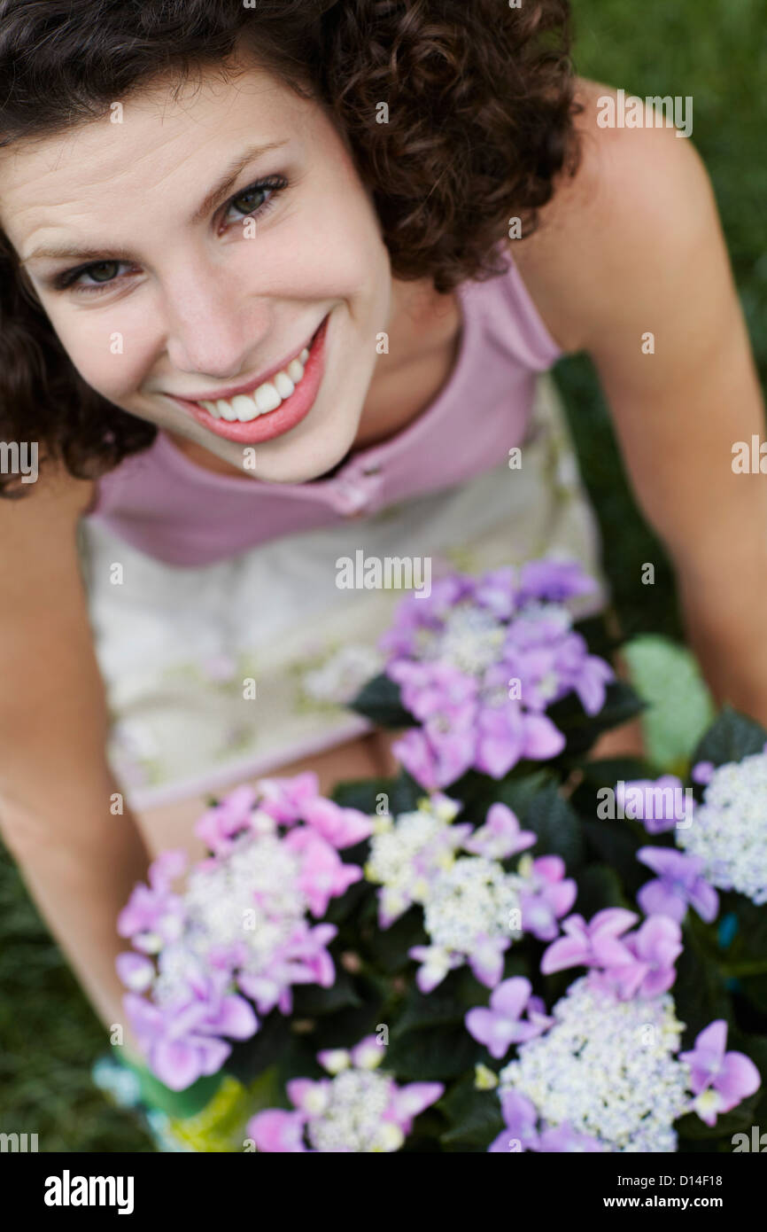 portrait of young woman with flowers Stock Photo
