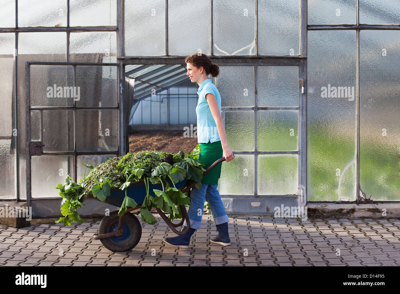 portrait of young woman working in nursery Stock Photo