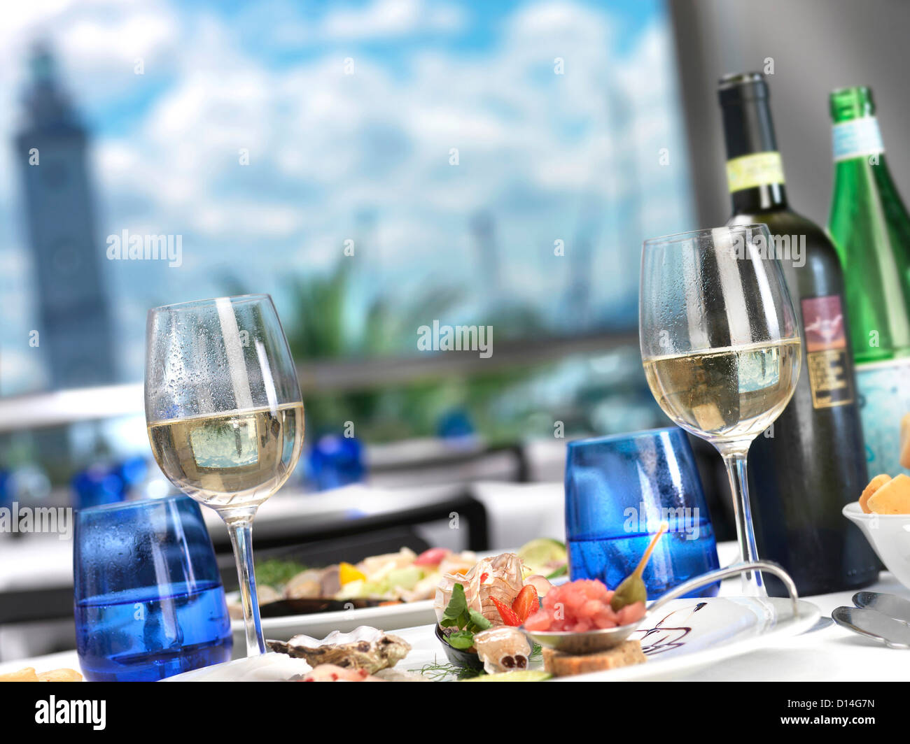 Wine glasses seafood dish on table restaurant Stock Photo