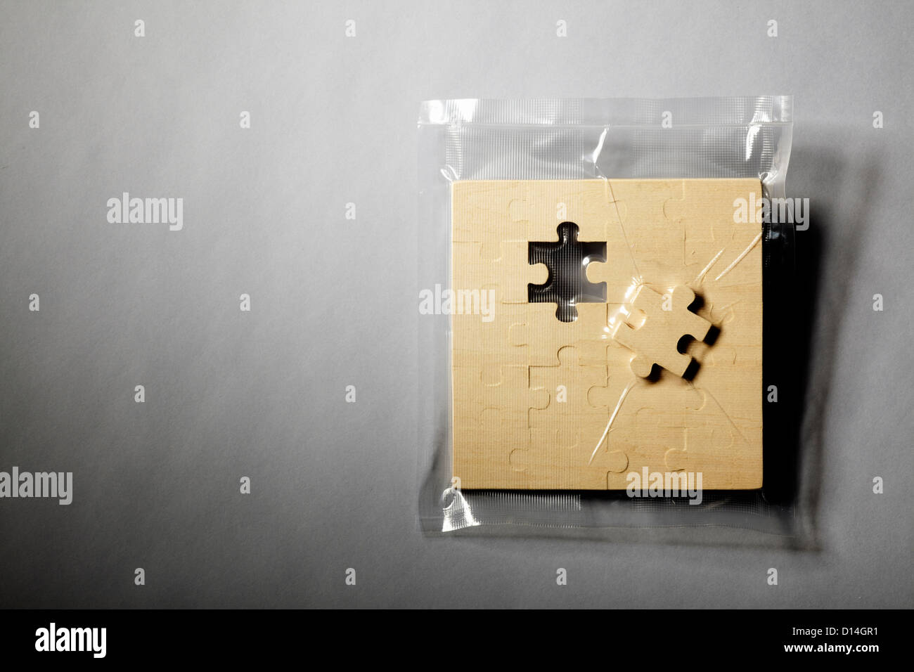 Jigsaw puzzle shrink wrapped in plastic Stock Photo