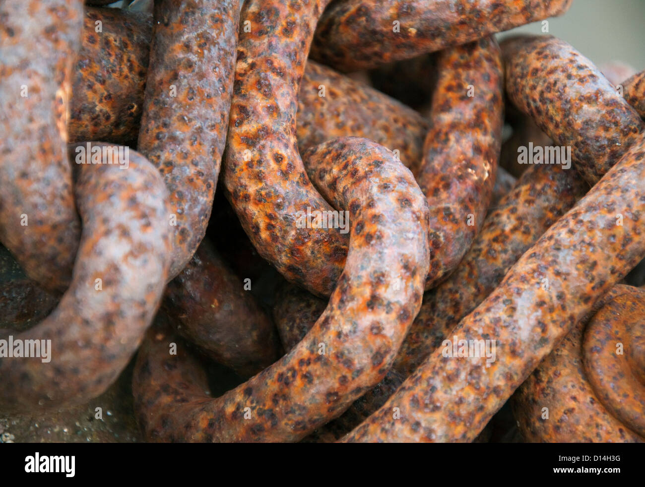 Close up of rusty chains in Braye Harbour Alderney, Channel Islands Stock Photo