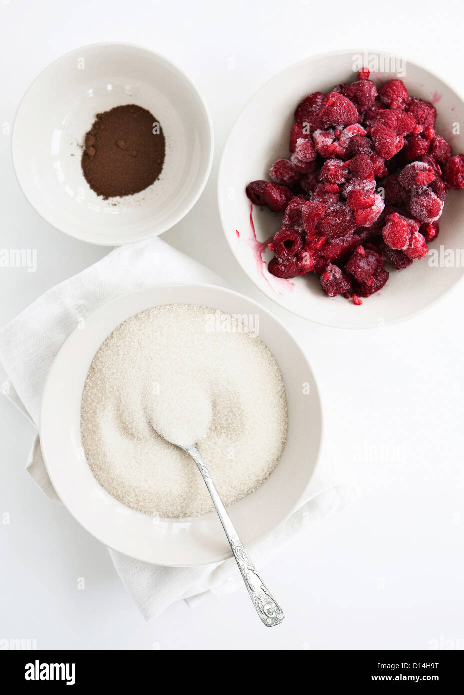 Bowls of fruit, sugar and cocoa Stock Photo