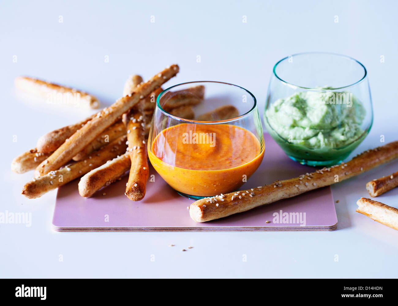 Breadsticks with dipping sauce Stock Photo