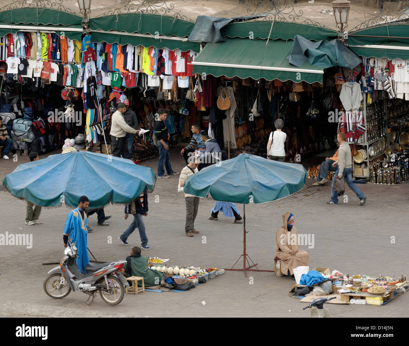 Crowds, food stalls and shops in Djemaa El Fna square, Marrakech, Morocco. Stock Photo