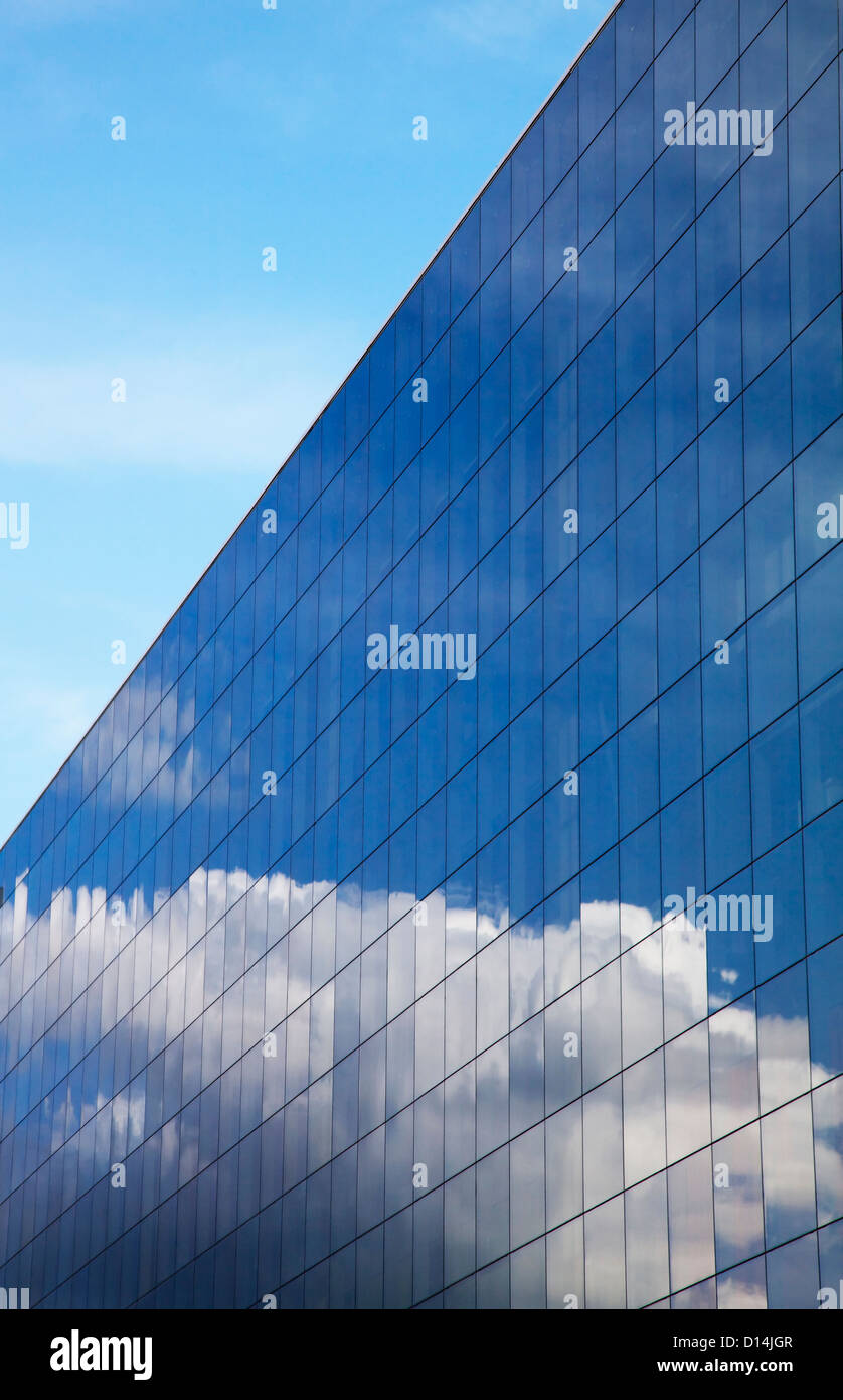 Modern office building and blue clear sky reflection Stock Photo - Alamy