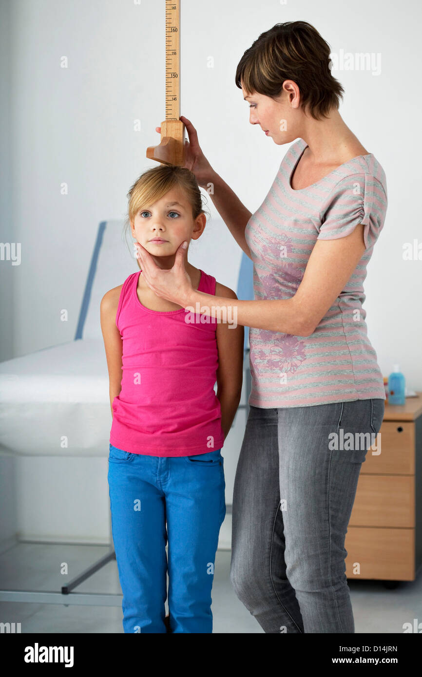 MEASURING HEIGHT IN A CHILD Stock Photo