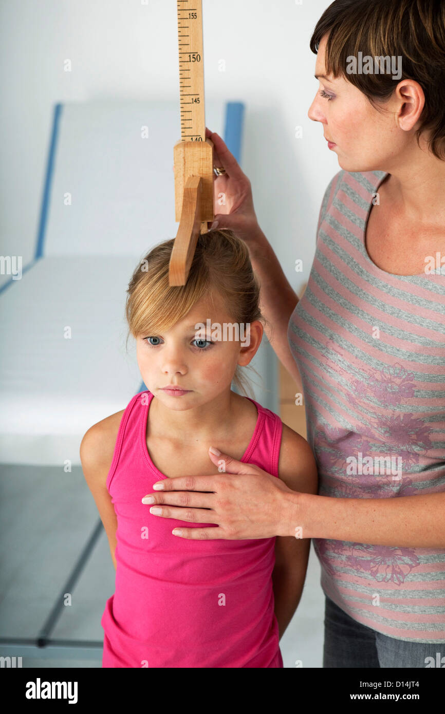 MEASURING HEIGHT IN A CHILD Stock Photo