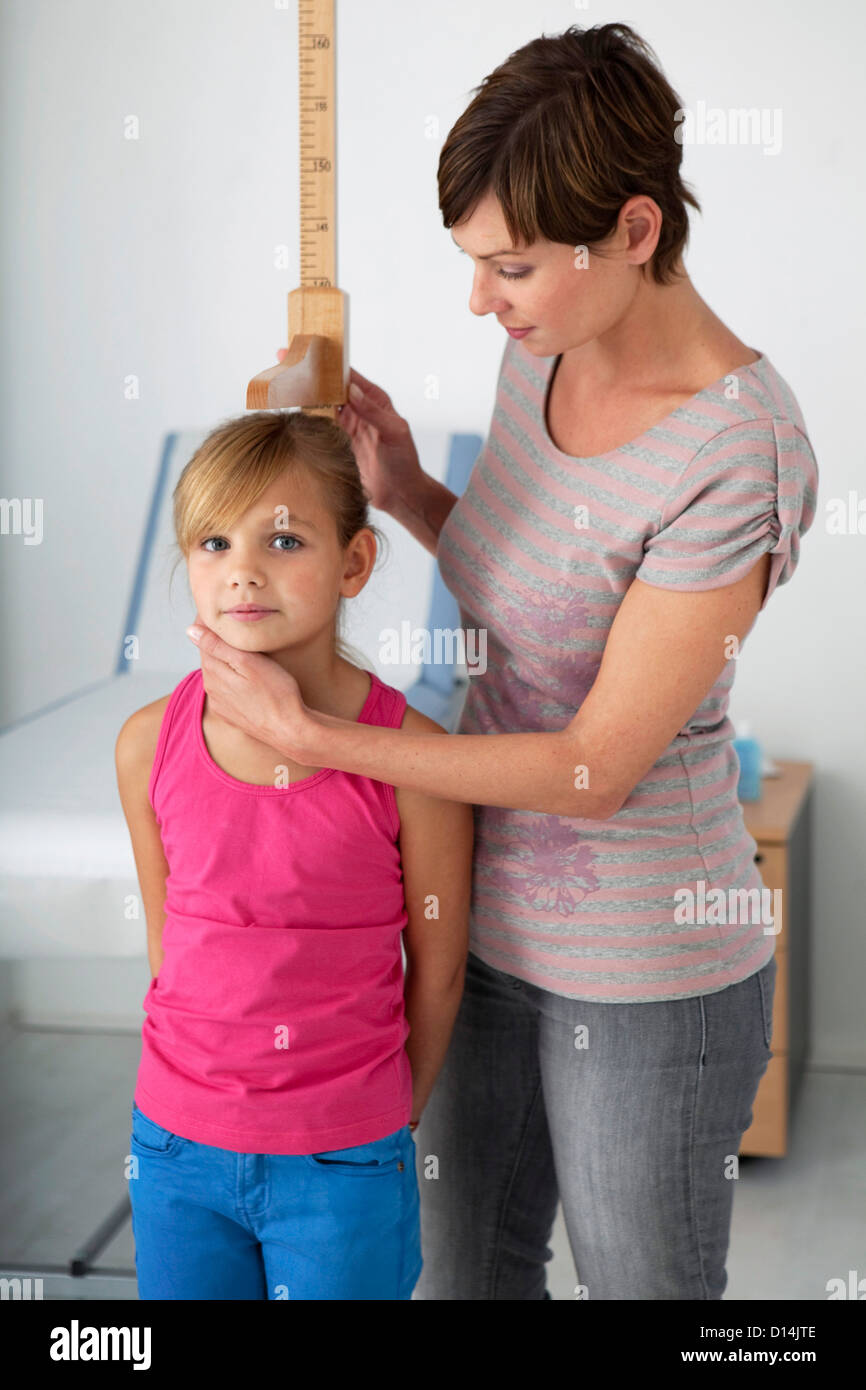 MEASURING HEIGHT IN A CHILD Stock Photo